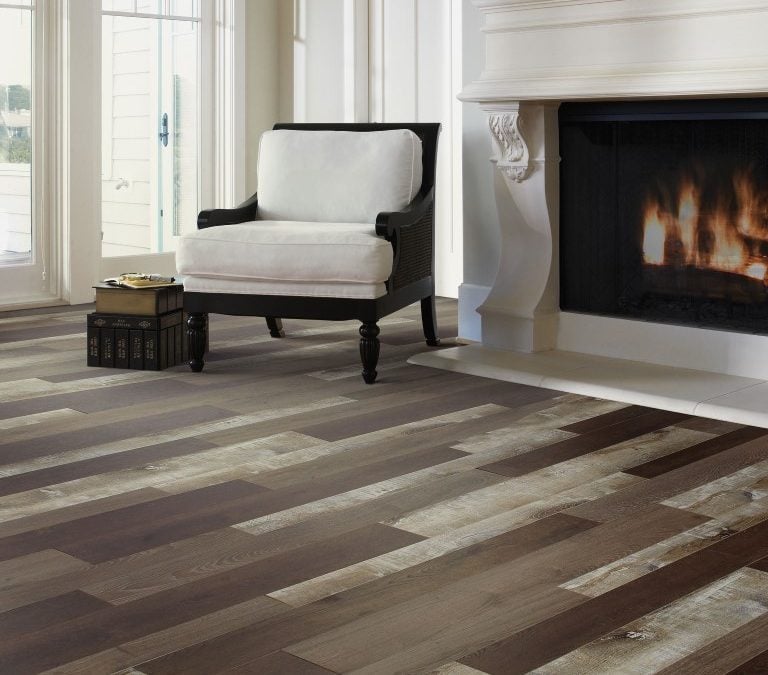 Mix of flooring colors in contemporary living room with fireplace and floor to ceiling windows
