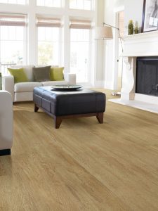 Light oak floor in living room with white fireplace