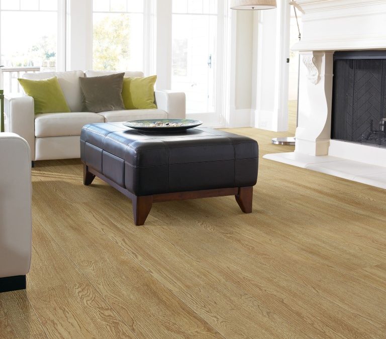 Light oak floor in living room with white fireplace