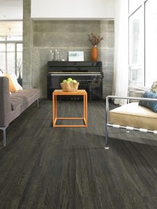 Living room with dark vinyl plank flooring